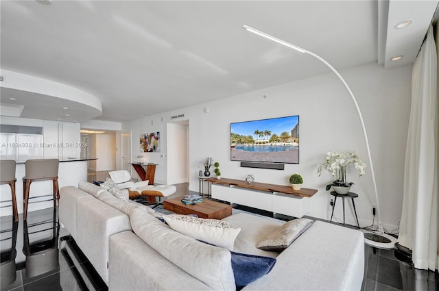 living room featuring dark tile patterned flooring