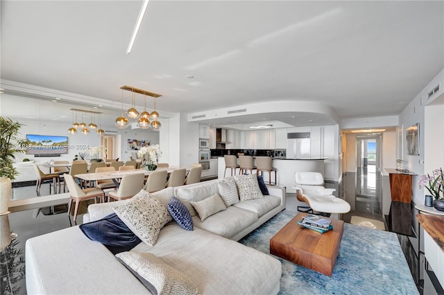 living room featuring a chandelier