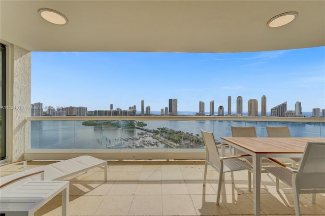 balcony with a view of city and a water view