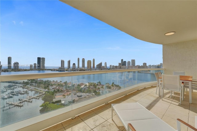 balcony with a water view and a city view