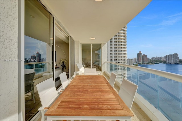 balcony featuring a water view