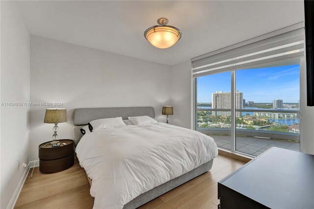 bedroom with light hardwood / wood-style floors