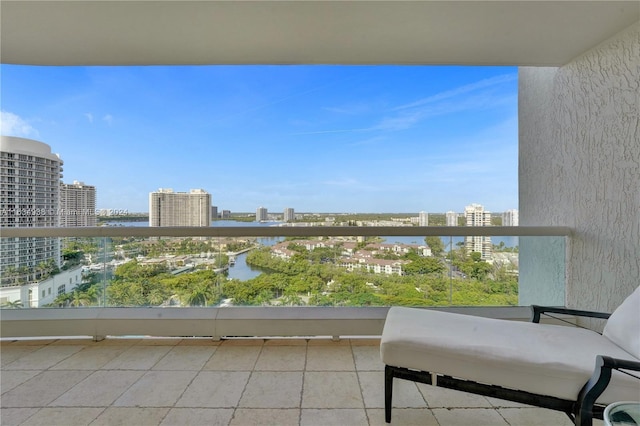 balcony with a water view and a city view