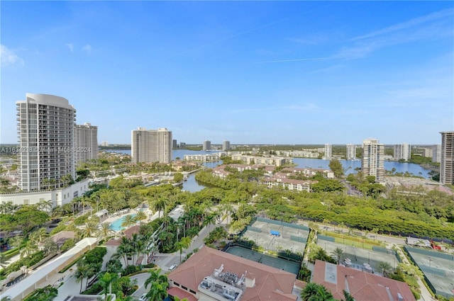 birds eye view of property with a water view and a city view