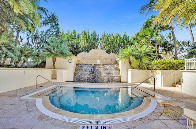 view of pool featuring a swimming pool, a patio area, and a fenced backyard