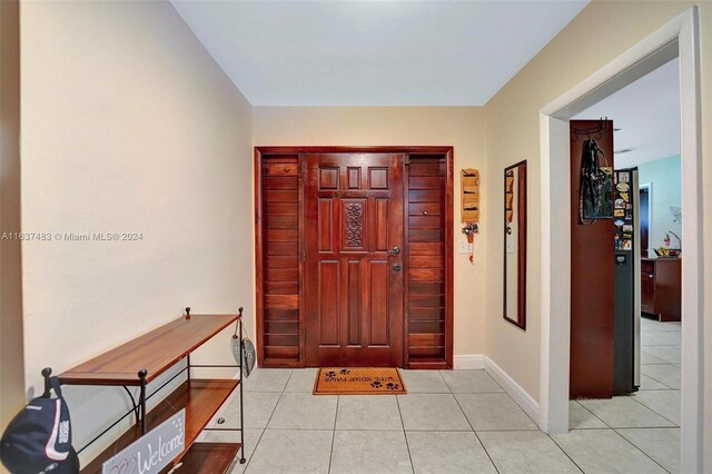 foyer featuring light tile patterned floors