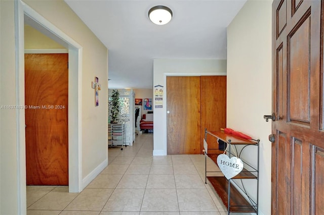 hallway with light tile patterned flooring