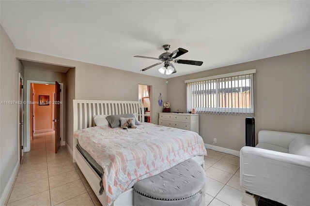 tiled bedroom with ceiling fan