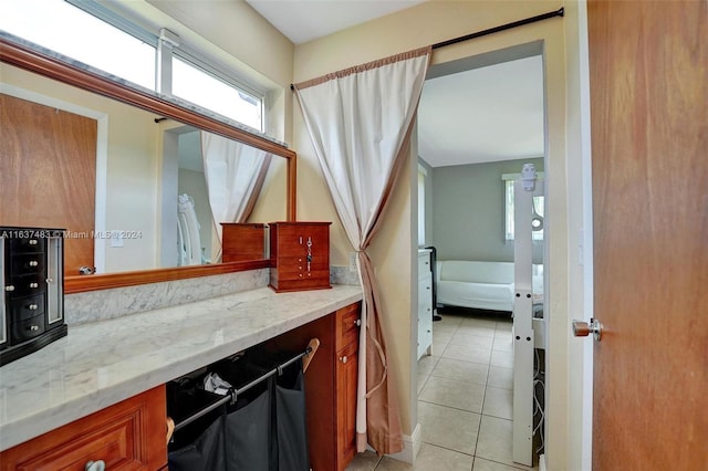 bathroom with tile patterned floors and vanity