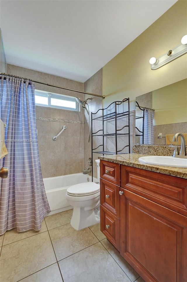 full bathroom featuring tile patterned floors, vanity, shower / bath combination with curtain, and toilet