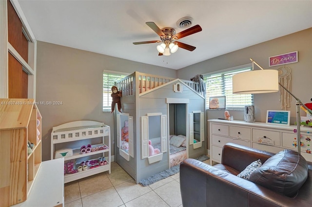 tiled bedroom with ceiling fan