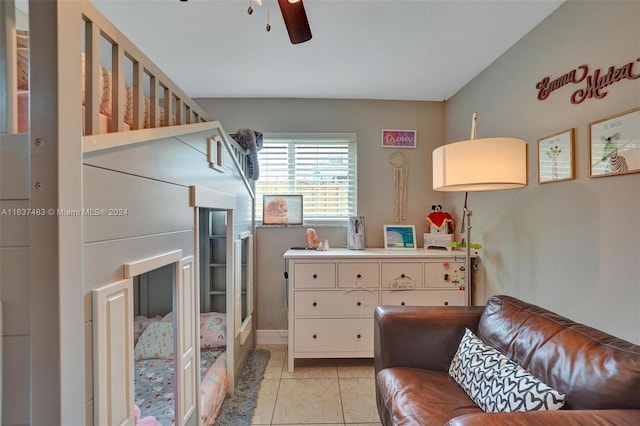 living room featuring ceiling fan and light tile patterned flooring