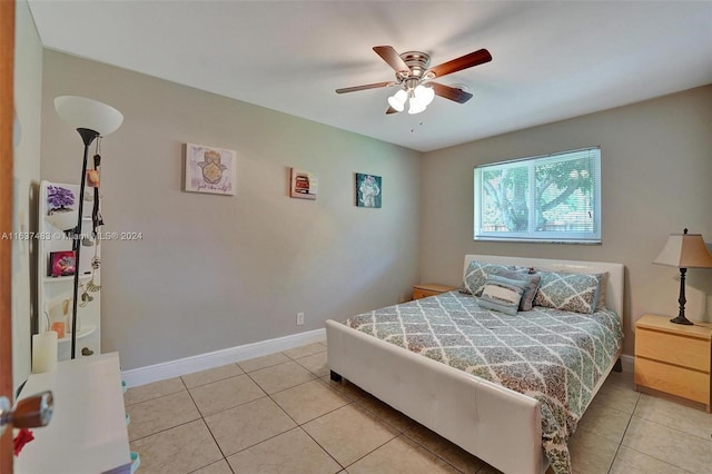 tiled bedroom with ceiling fan