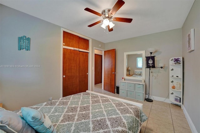 bedroom with tile patterned flooring and ceiling fan