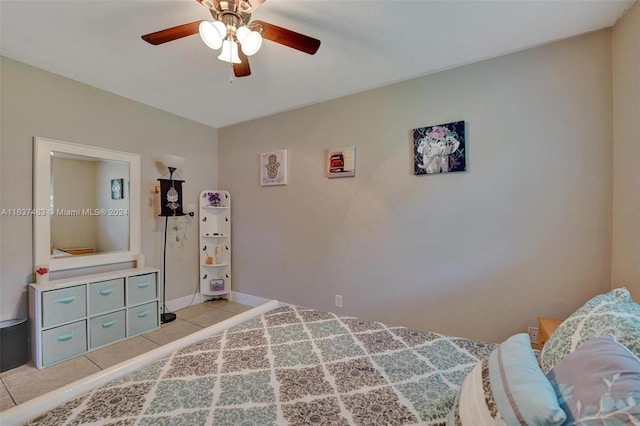 bedroom with ceiling fan and light tile patterned floors