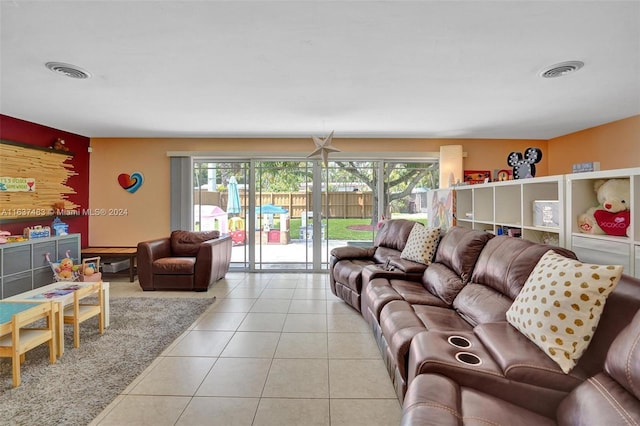 tiled living room featuring a wealth of natural light