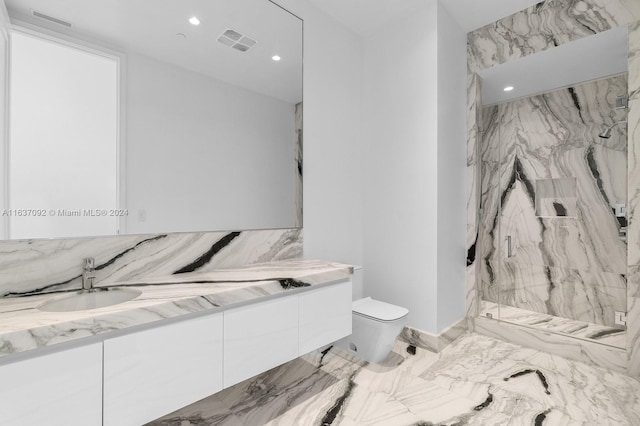 bathroom with tile patterned floors, vanity, and toilet