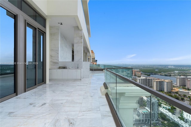 balcony featuring a water view