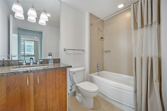 full bathroom featuring tile patterned floors, toilet, vanity, and shower / tub combo with curtain