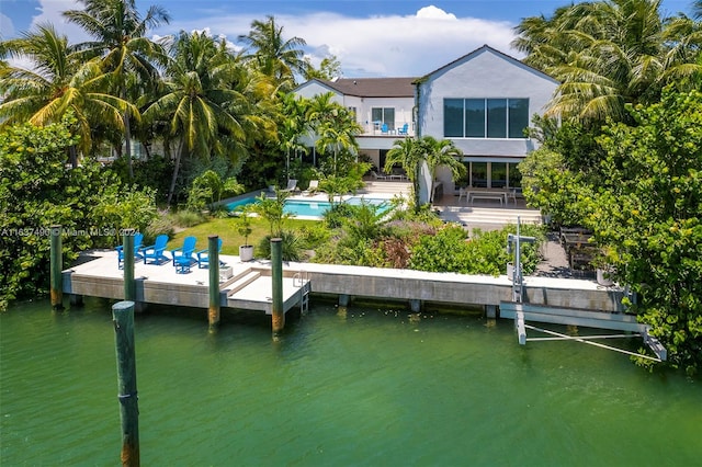 dock area with a patio and a water view