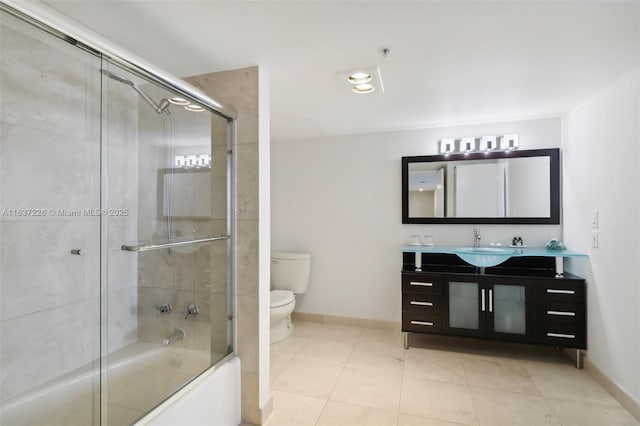 full bathroom featuring toilet, tile patterned flooring, enclosed tub / shower combo, and vanity