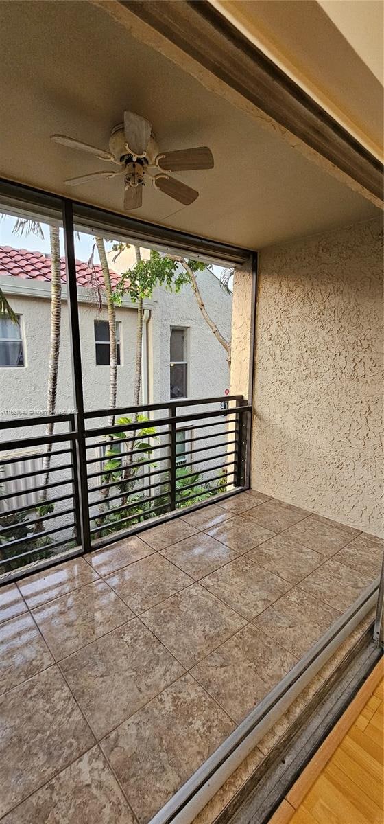 view of patio / terrace featuring a balcony and ceiling fan