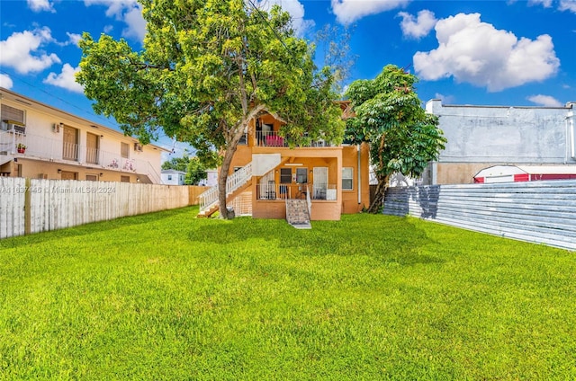 view of yard featuring stairs and fence