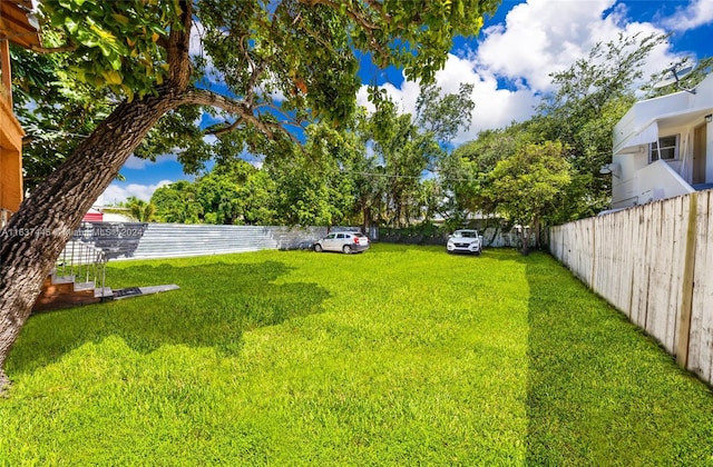 view of yard featuring fence