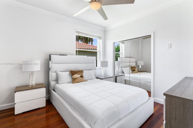 bedroom with ceiling fan, baseboards, ornamental molding, a closet, and dark wood-style floors