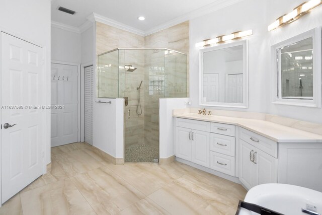 bathroom featuring tile patterned floors, crown molding, vanity, and an enclosed shower