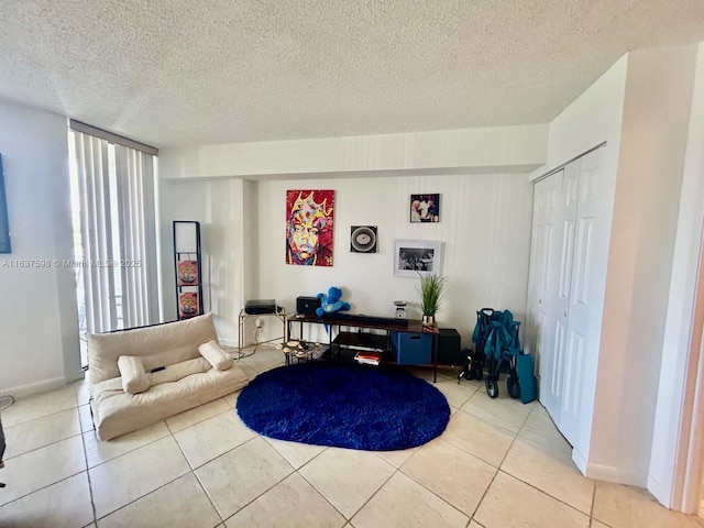 3300 NE 191st St Unit 515, Aventura, FL 33180 - living room featuring tile patterned floors and a textured ceiling