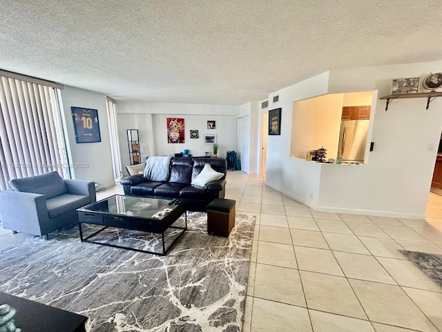 3300 NE 191st St Unit 515, Aventura, FL 33180 - tiled living area featuring a textured ceiling