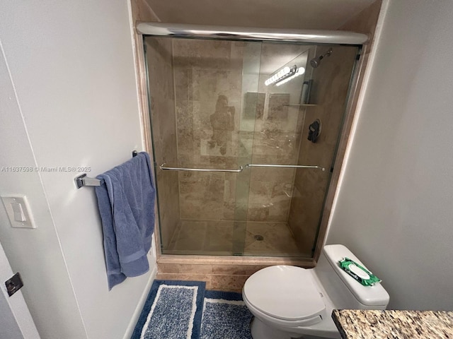 3300 NE 191st St Unit 515, Aventura, FL 33180 - bathroom featuring a stall shower, vanity, and tile patterned floors