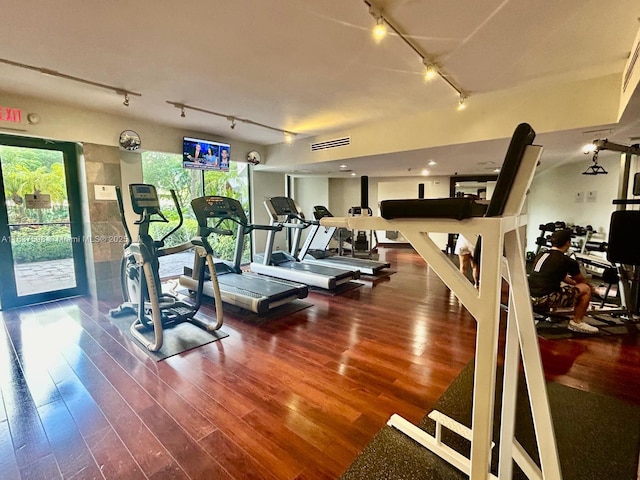 3300 NE 191st St Unit 515, Aventura, FL 33180 - exercise room featuring track lighting and wood finished floors