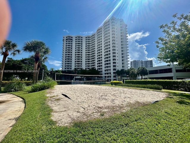 3300 NE 191st St Unit 515, Aventura, FL 33180 - view of community with volleyball court and a yard