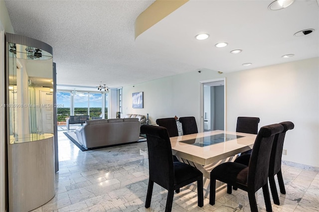 dining area with a textured ceiling