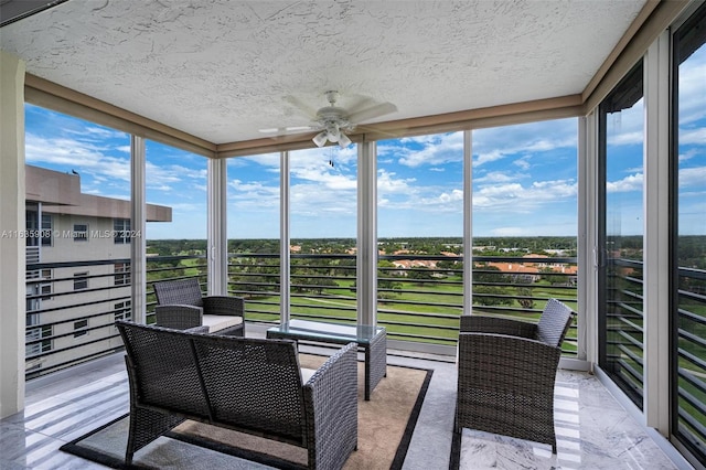 sunroom / solarium with ceiling fan