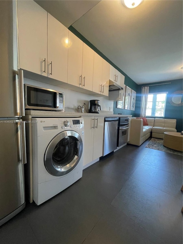 clothes washing area featuring washer / clothes dryer