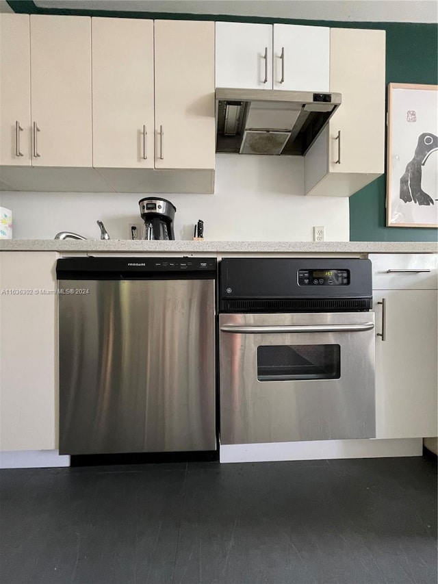 kitchen with white cabinets, appliances with stainless steel finishes, and ventilation hood