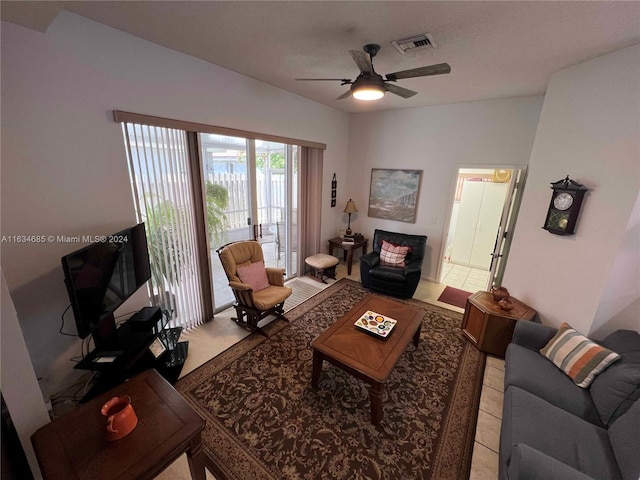 living area featuring visible vents and a ceiling fan