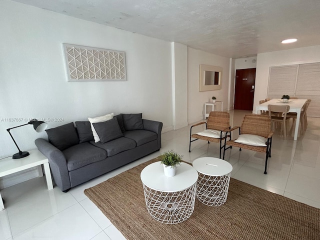 living room featuring light tile patterned flooring