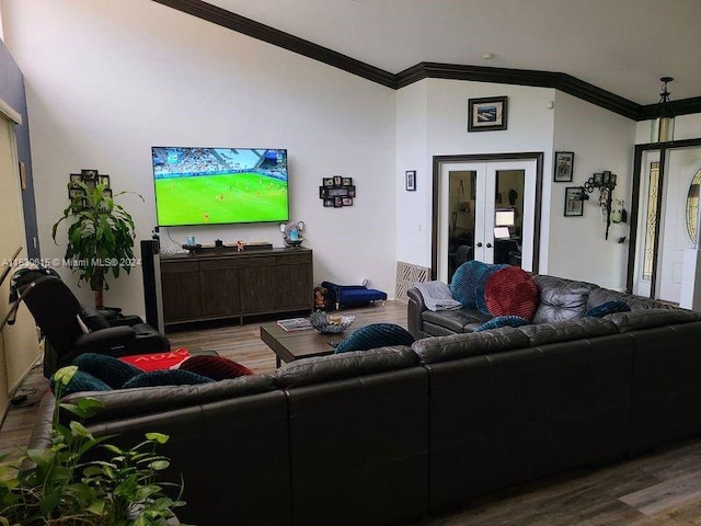 living room featuring wood-type flooring, crown molding, and french doors