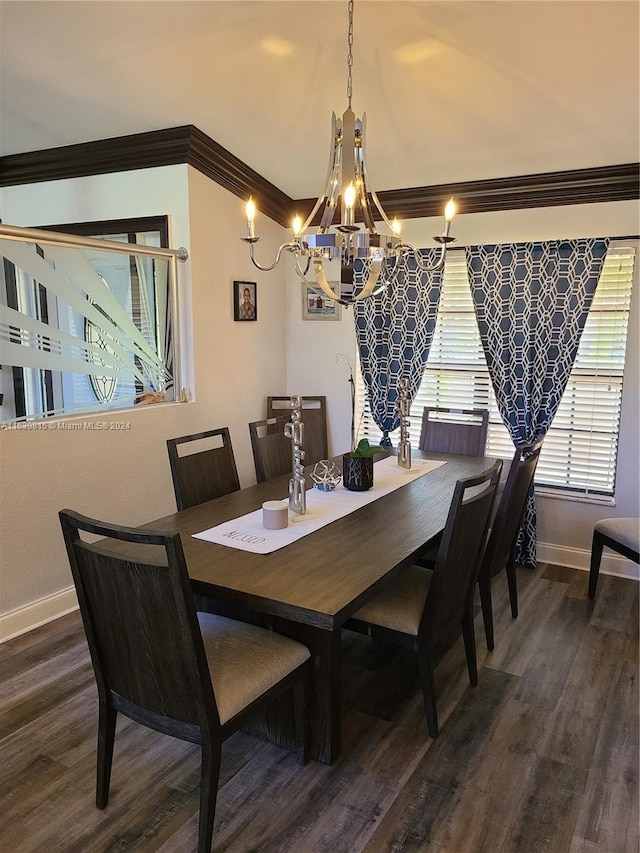 dining space with crown molding, a chandelier, and dark hardwood / wood-style floors