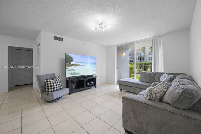 tiled living room with a textured ceiling