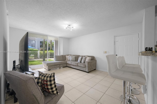 tiled living room with a textured ceiling