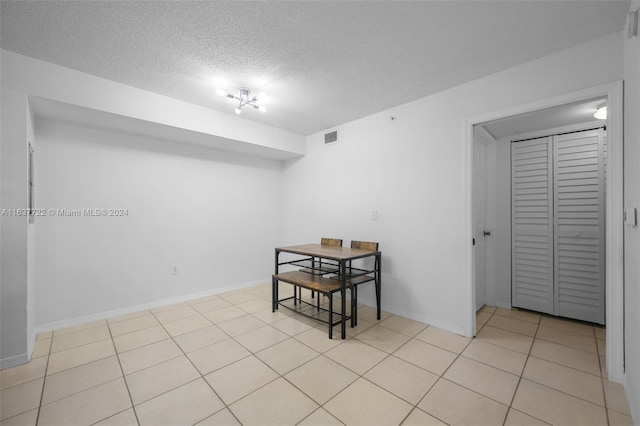 interior space with a textured ceiling