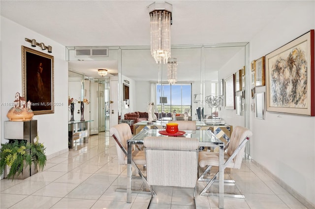 tiled dining space featuring a textured ceiling