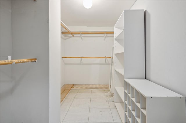 walk in closet featuring light tile patterned floors