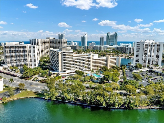 birds eye view of property with a water view