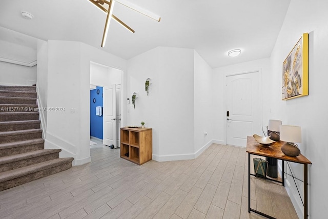 corridor with light hardwood / wood-style flooring